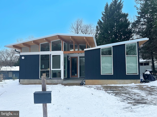 view of snow covered house