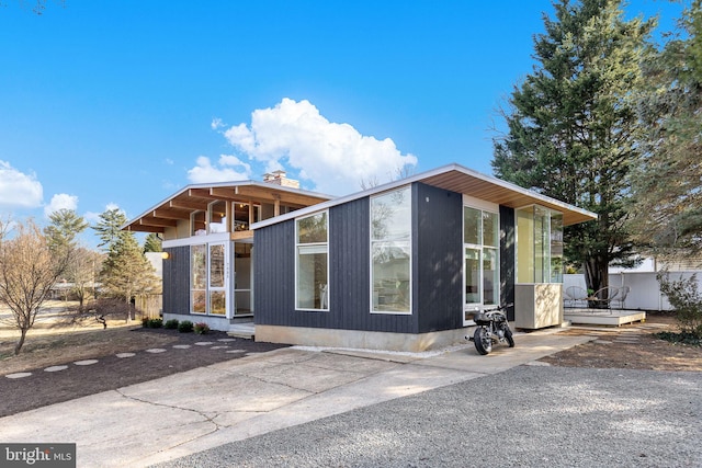 view of front of home featuring a sunroom