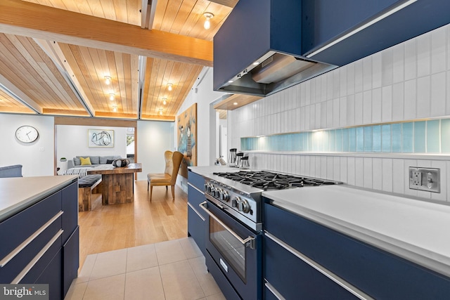 kitchen with wooden ceiling, blue cabinetry, stainless steel range, and light tile patterned flooring