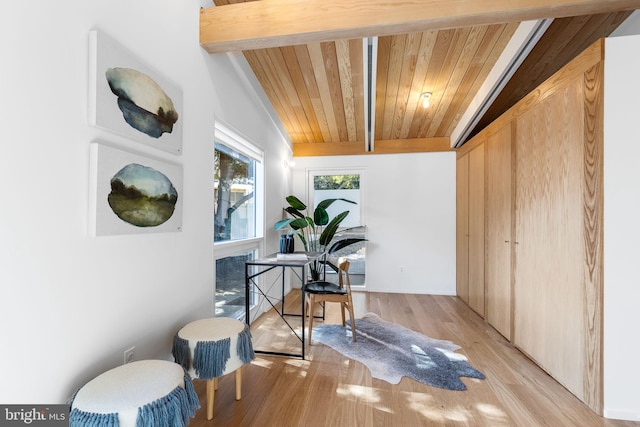 interior space featuring wood ceiling, light wood-type flooring, and beam ceiling