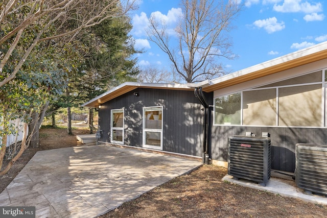 back of property featuring a patio area and central AC unit