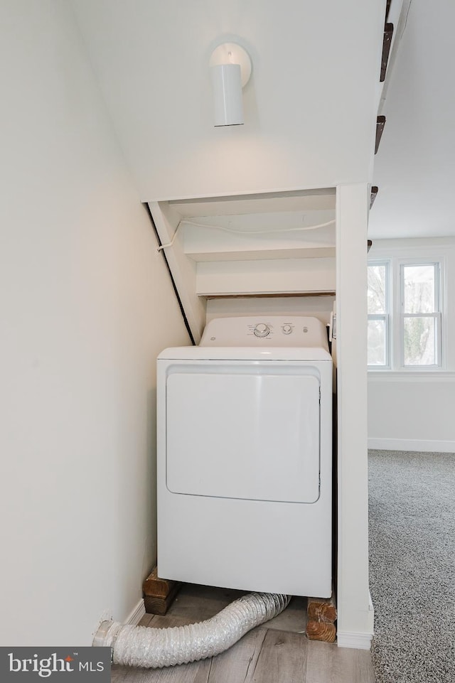 laundry area with washer / dryer and carpet