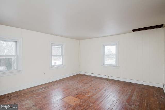 empty room featuring hardwood / wood-style flooring