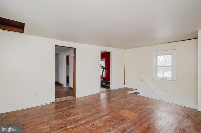 spare room featuring hardwood / wood-style flooring