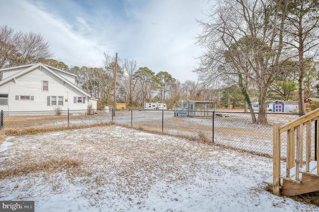 view of yard layered in snow