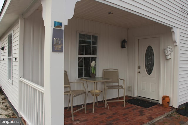 doorway to property featuring covered porch