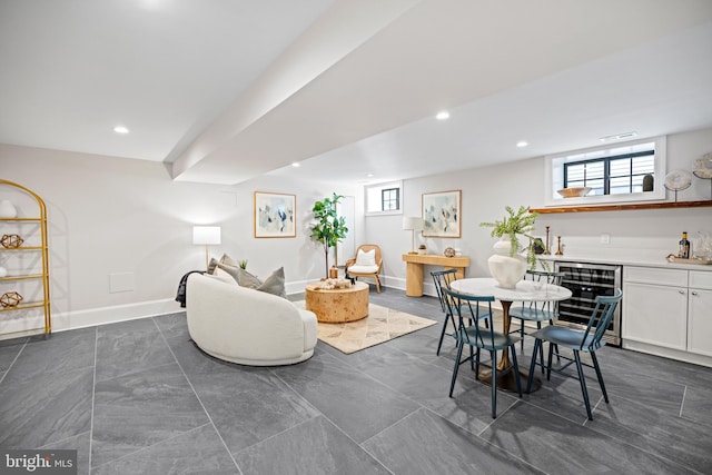 dining room with indoor bar, wine cooler, and a wealth of natural light