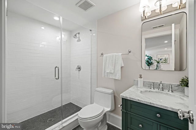 bathroom with walk in shower, vanity, and toilet