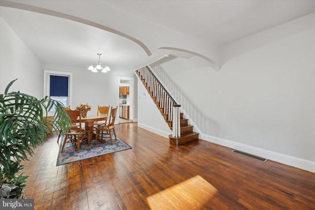 dining area featuring a chandelier and hardwood / wood-style flooring