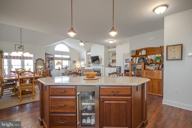 kitchen with ceiling fan with notable chandelier, hanging light fixtures, wine cooler, and dark wood-type flooring