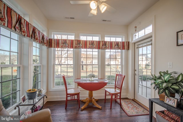 sunroom / solarium featuring ceiling fan