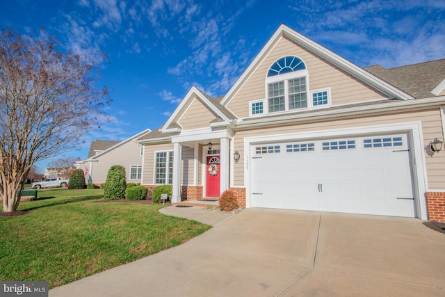 view of front of property with a front yard and a garage