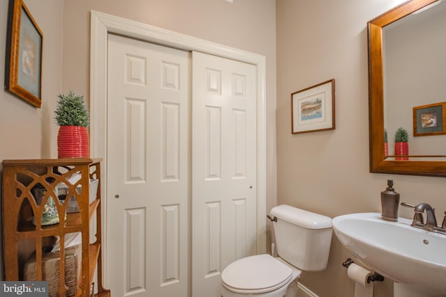 bathroom with toilet and sink