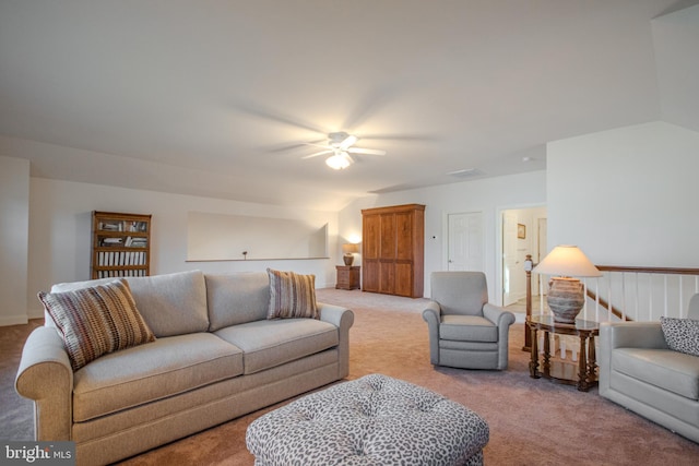 living room with light carpet, ceiling fan, and vaulted ceiling