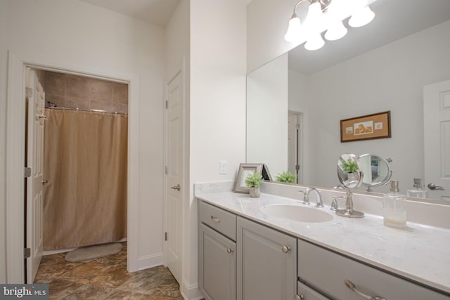 bathroom with vanity and curtained shower