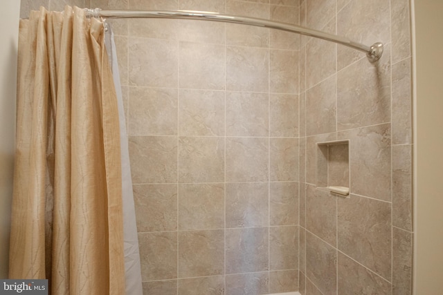 bathroom featuring a shower with curtain