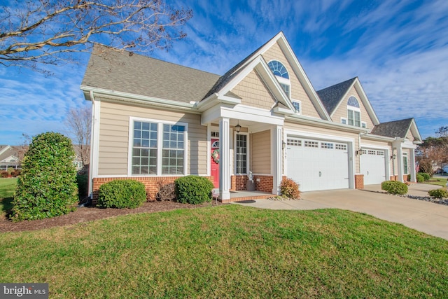 craftsman house featuring a front yard and a garage