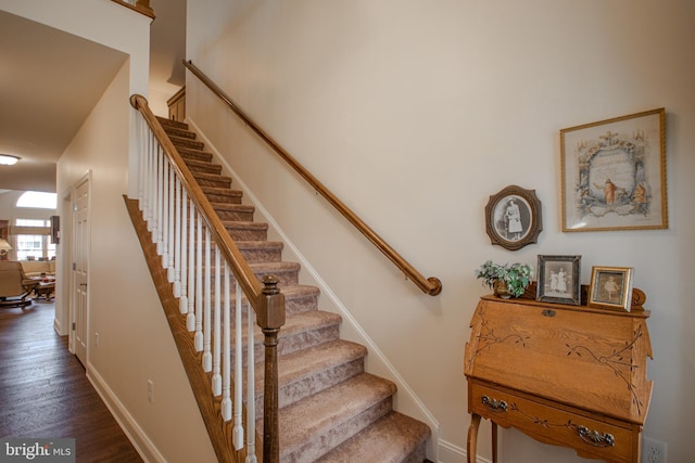 staircase featuring hardwood / wood-style floors