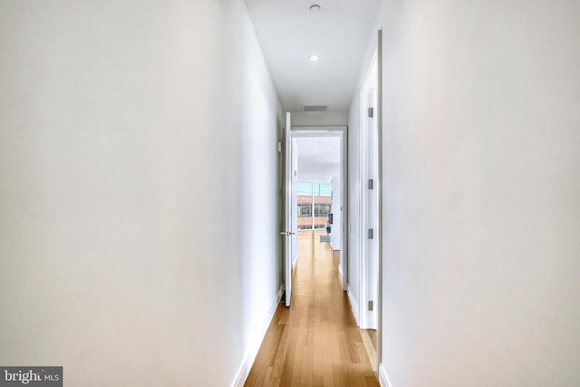 hallway featuring light hardwood / wood-style flooring