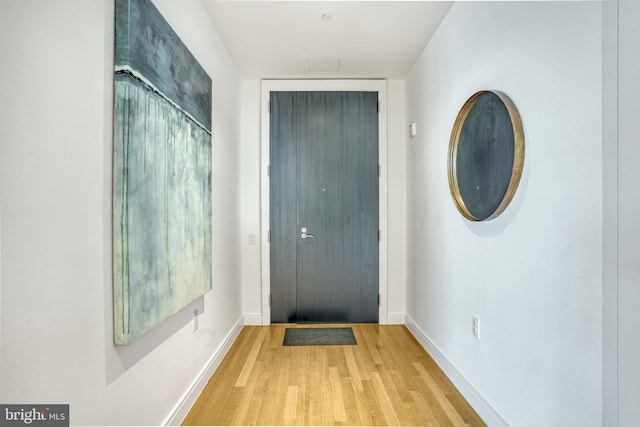 doorway to outside featuring light hardwood / wood-style flooring