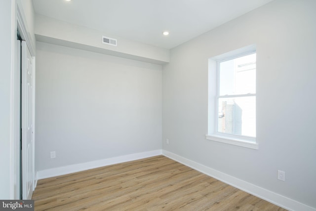 empty room with light wood-type flooring