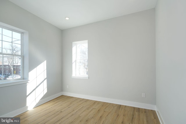 unfurnished room with light hardwood / wood-style flooring