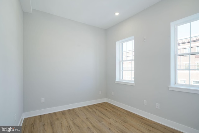 unfurnished room with light hardwood / wood-style flooring