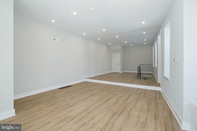 spare room featuring light hardwood / wood-style flooring