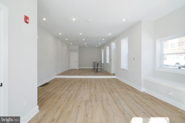 empty room with light hardwood / wood-style floors