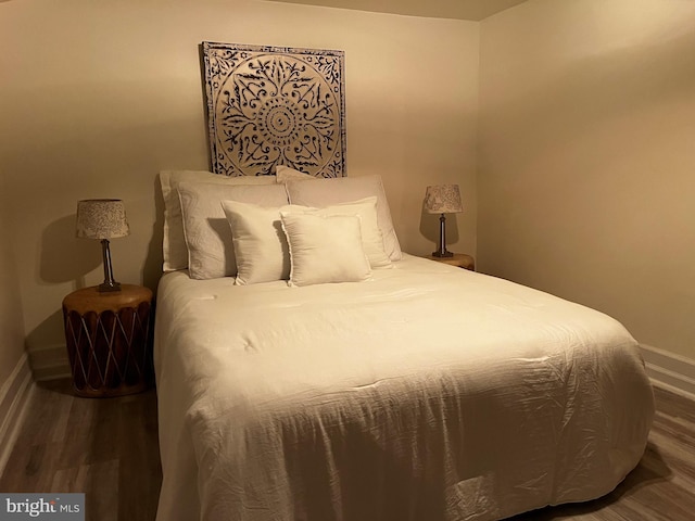 bedroom with hardwood / wood-style flooring