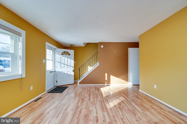 entryway with light hardwood / wood-style flooring