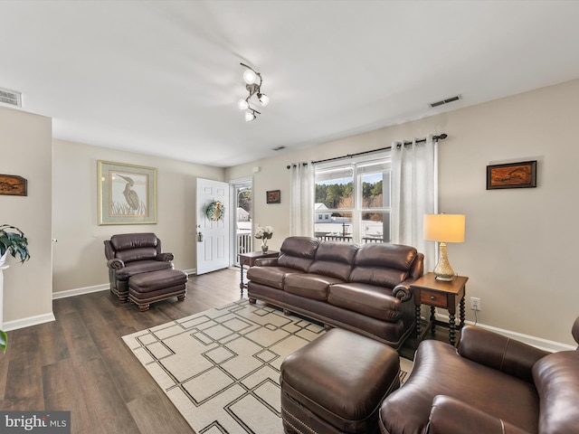 living room with dark wood-type flooring