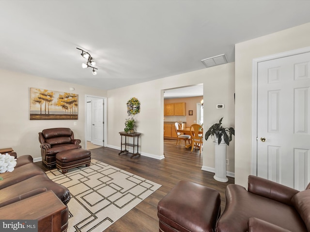 living room with dark hardwood / wood-style floors