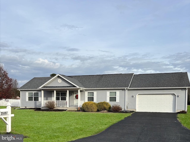 ranch-style home with a porch, a garage, and a front yard