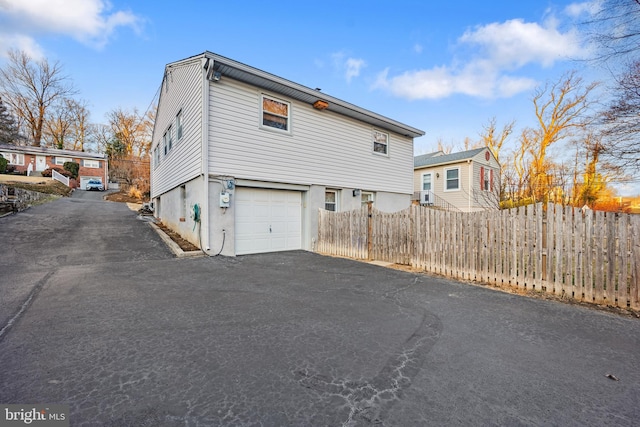 view of side of home featuring a garage