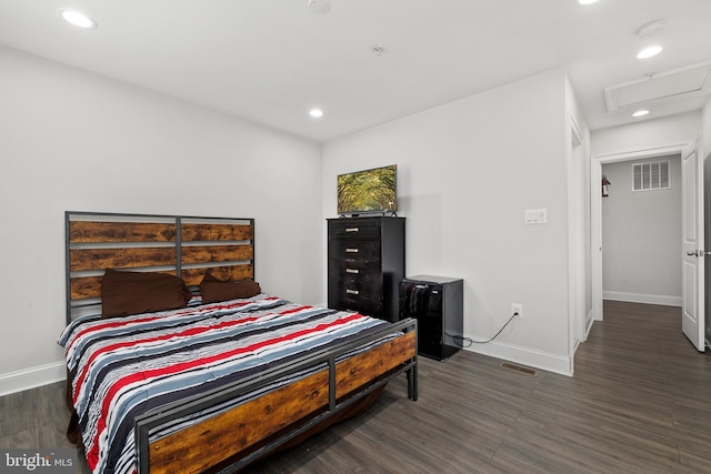 bedroom featuring dark hardwood / wood-style flooring