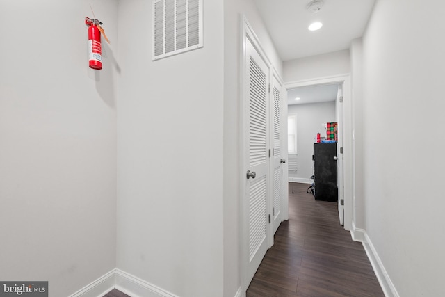 hallway featuring dark wood-type flooring