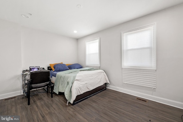 bedroom featuring dark hardwood / wood-style floors