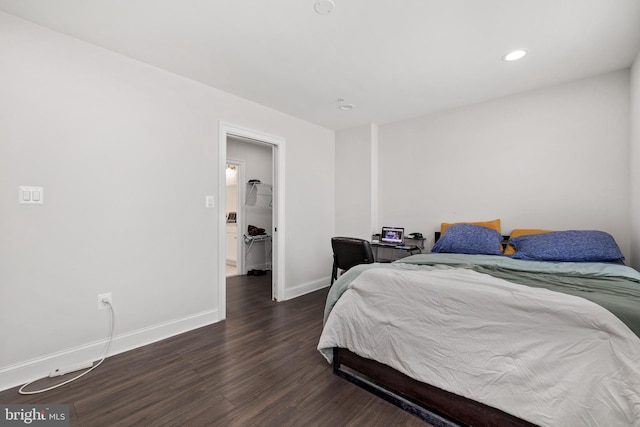 bedroom with dark wood-type flooring