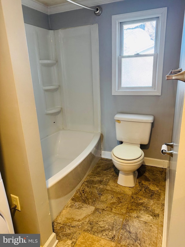 bathroom with shower / tub combination and toilet