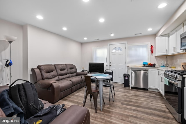 living room featuring dark wood-type flooring