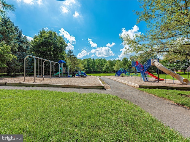 community play area with a lawn