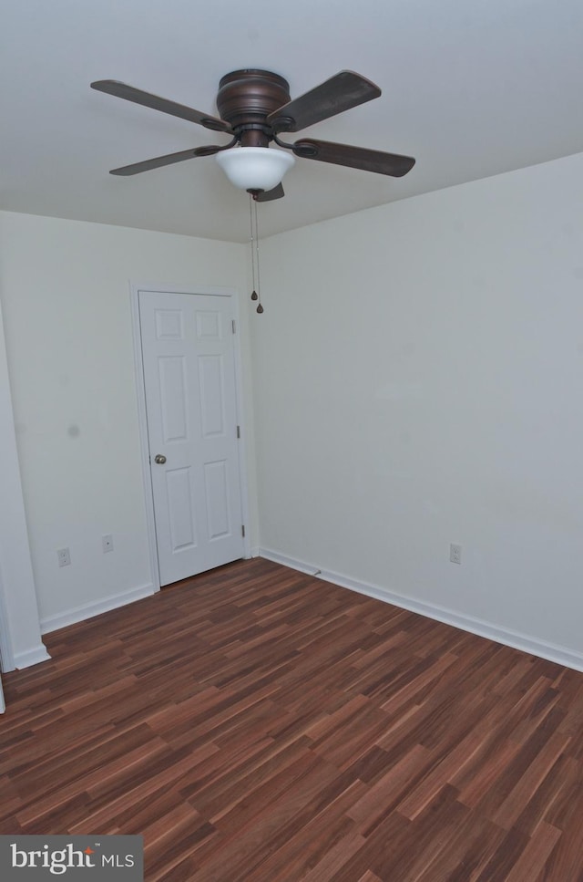 unfurnished room featuring dark hardwood / wood-style floors