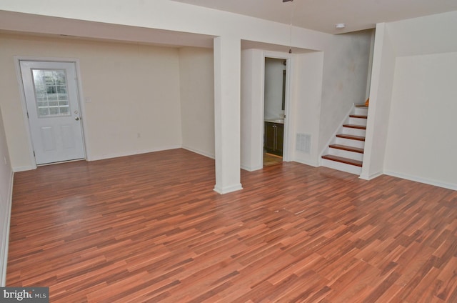 basement with hardwood / wood-style flooring