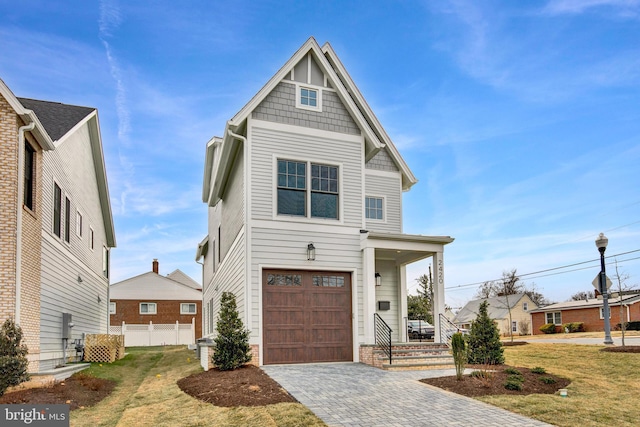 view of front of house with a front lawn and a garage