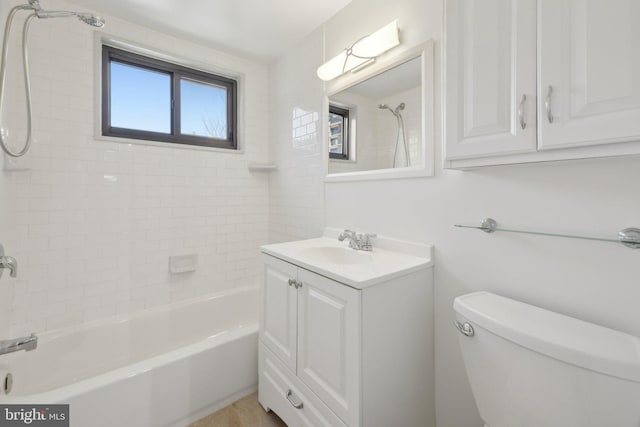 full bathroom featuring vanity, toilet, and tiled shower / bath combo