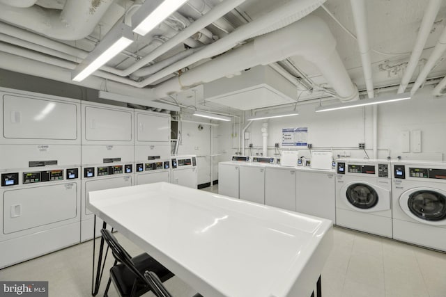 washroom with independent washer and dryer and stacked washer and dryer