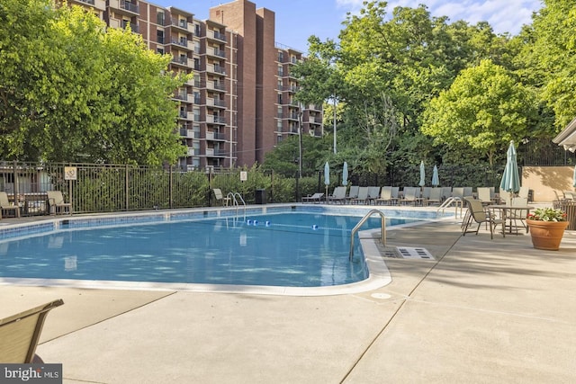 view of swimming pool featuring a patio area