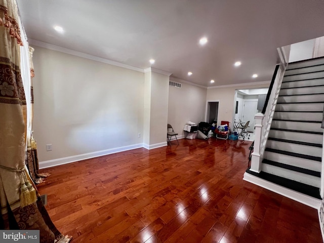 interior space featuring hardwood / wood-style flooring and ornamental molding