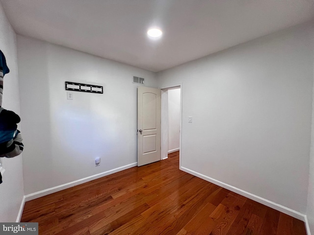 empty room with wood-type flooring